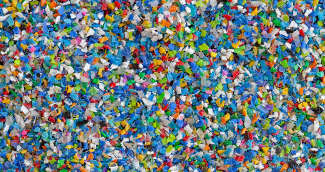 Crushed plastic granules for recycling. Plastic crusher. Recycled plastic with mixed colors. The concept of recycled plastic used