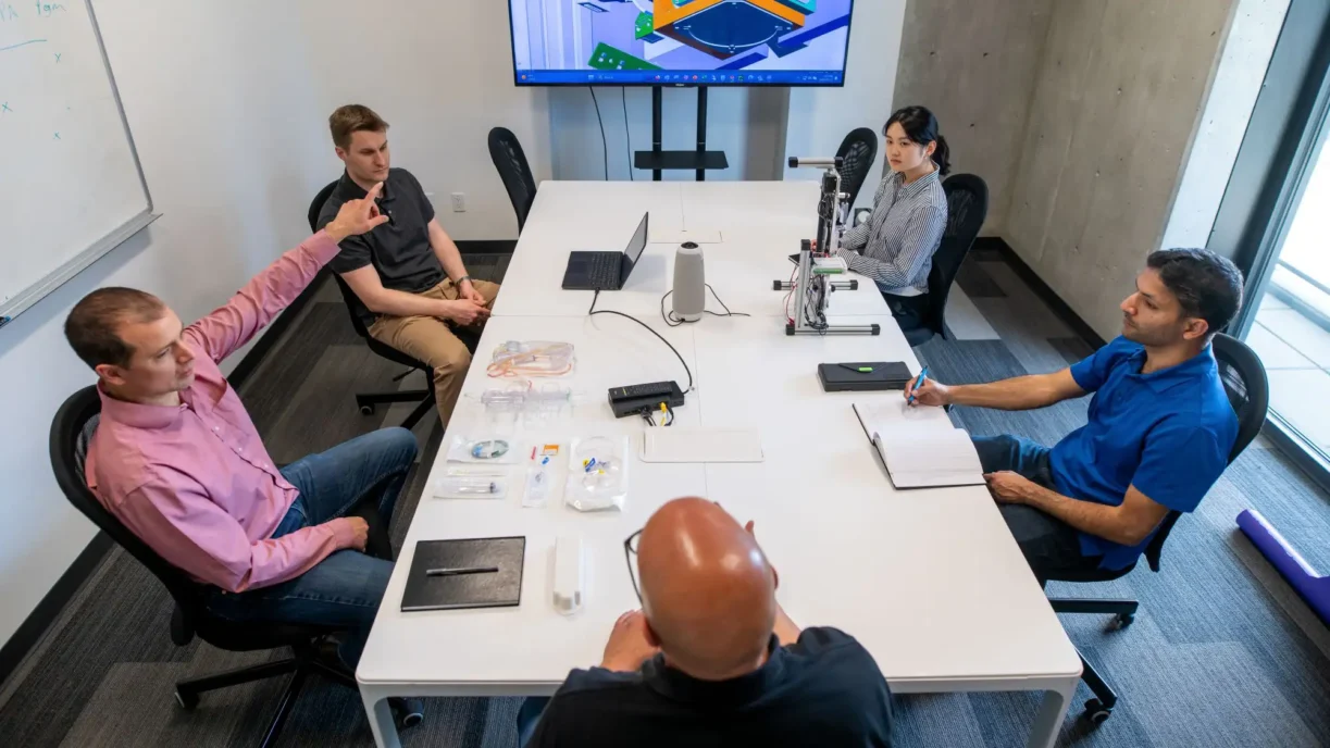 An EE partner explains an electrical architecture decision to the client team during design review