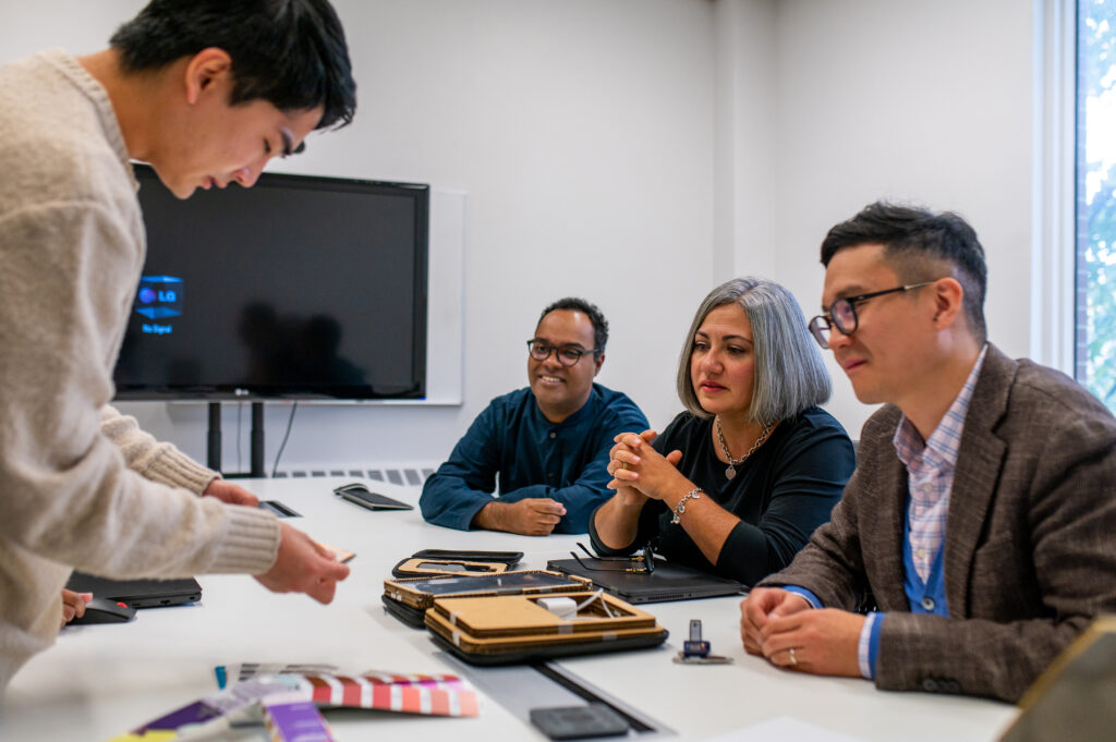 User group examining therapy device prototypes and color/material options