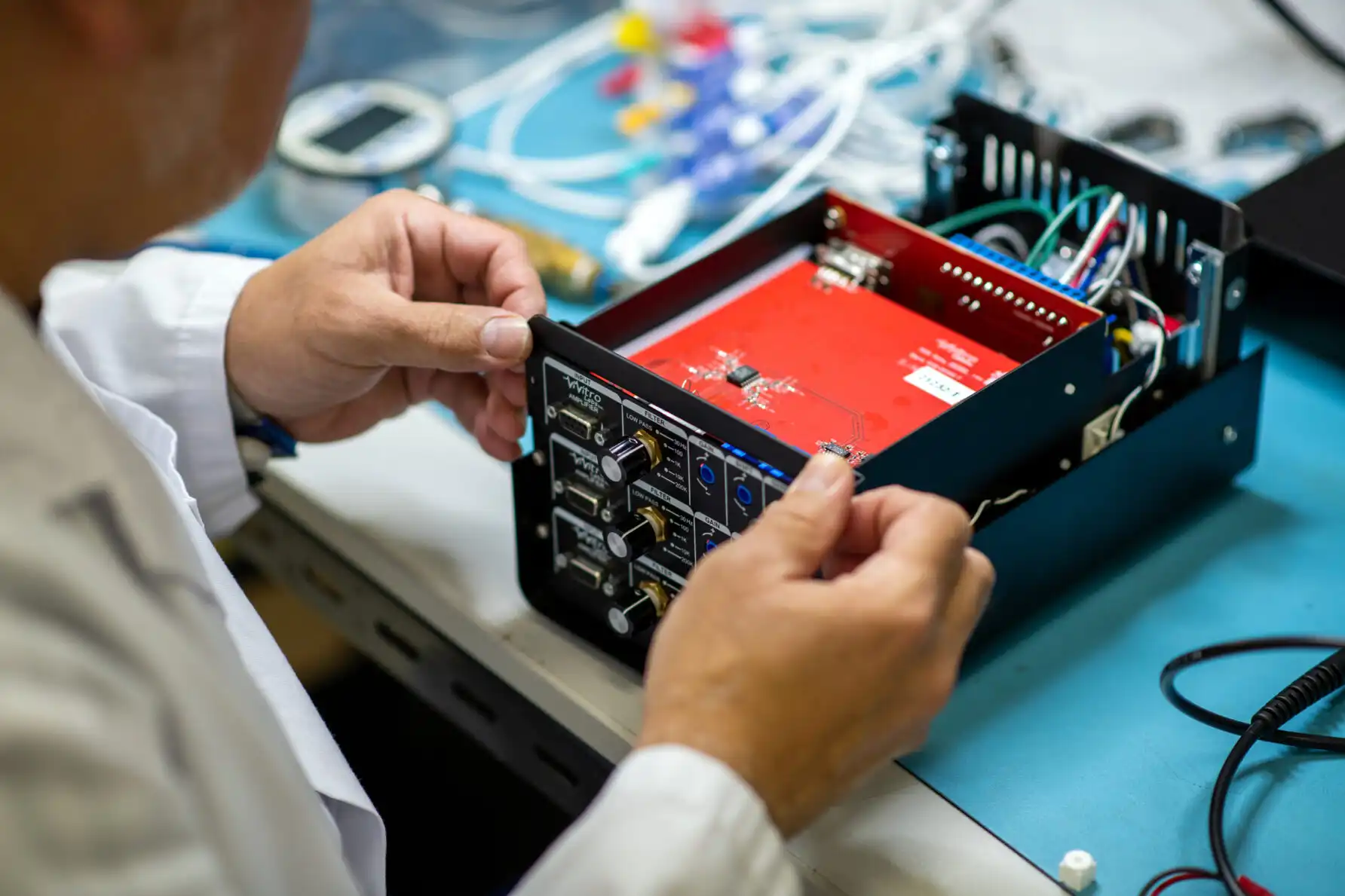 StarFish employees assembling medical device.
