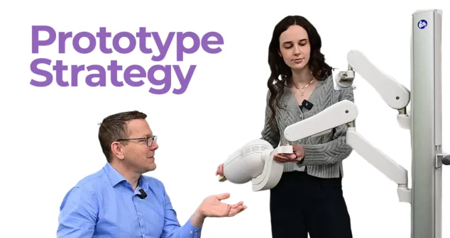 MedTech engineers discussing prototype strategy while demonstrating a medical device form prototype during product development.